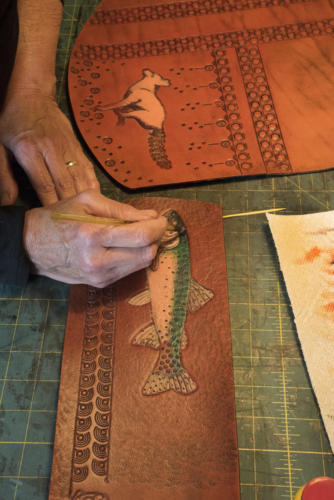 The slow multiple layers of leather paints to build up durable color on my carved work.