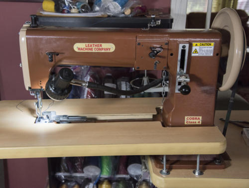 Cobra 4 industrial leather sewing machine with a cylinder arm. The table is removable.